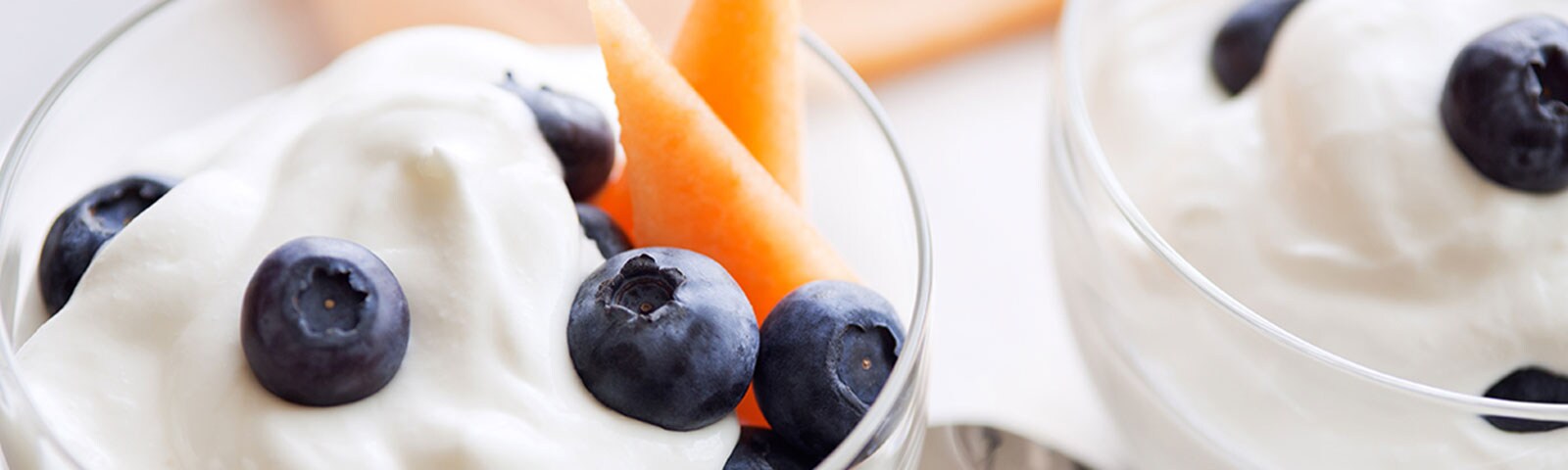 Blueberries and cantaloupe in a glass cup Blueberries and cantaloupe in a glass cup