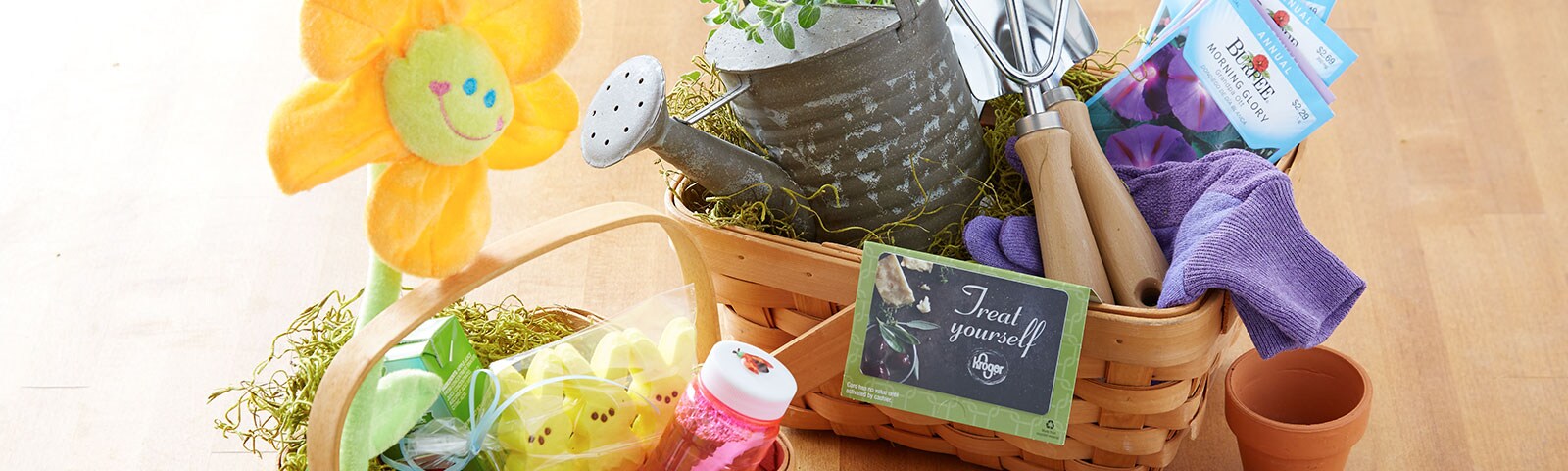 Colorful Easter baskets filled with candy, plush animals, art supplies and gardening tools on a hardwood floor