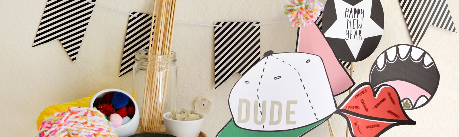 DIY photo booth props like oversized mouths and hats on wooden skewers